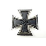 A German Third Reich Iron Cross first class, its pin stamped "107"