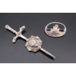 Two Scottish silver brooches, one depicting a longboat cast in an oval frame, Glasgow, 1953, and a