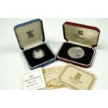 Silver commemorative crown, Pojoy Mint, cased with certificate, and silver £1 proof coin, Royal