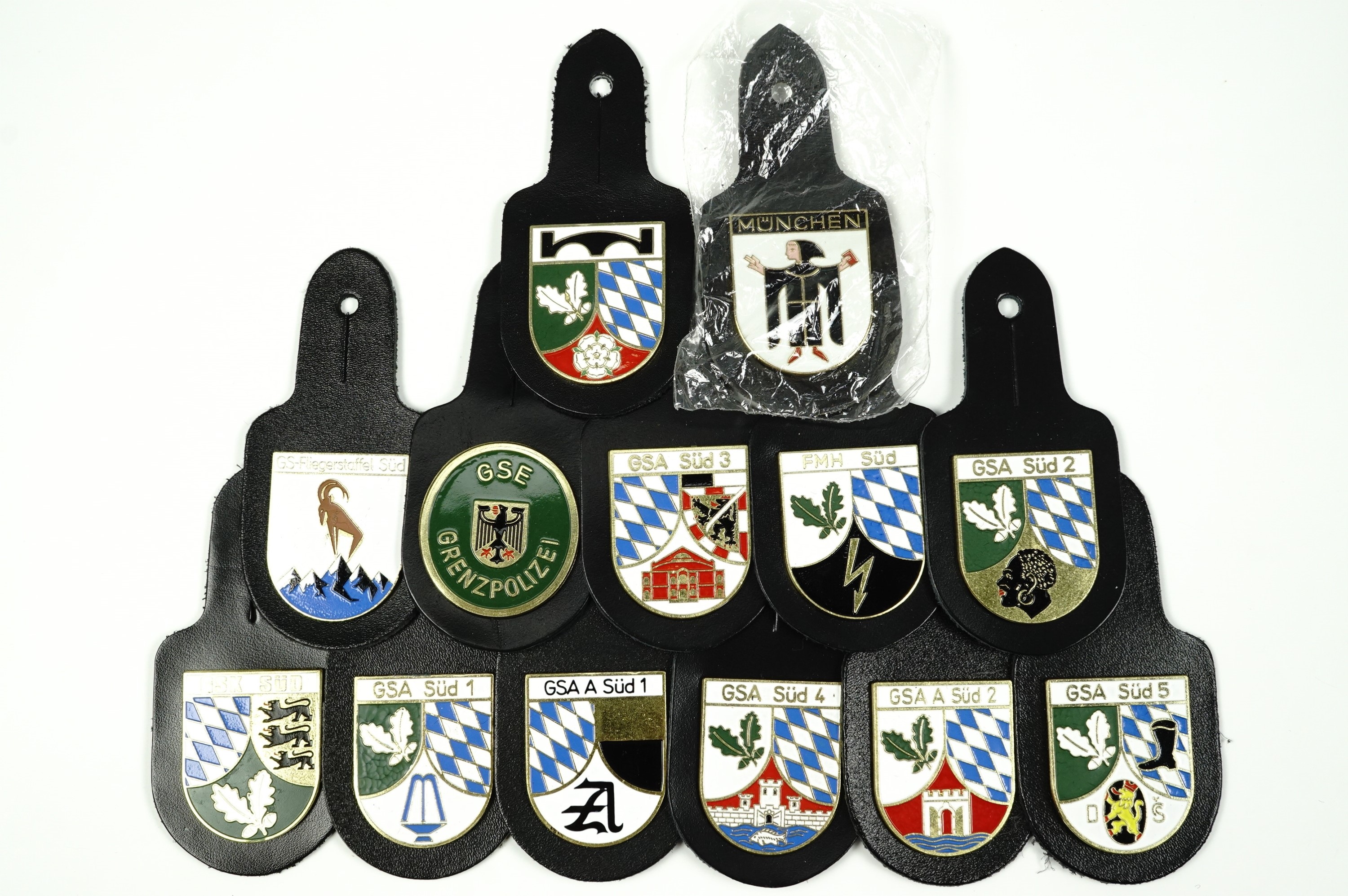 13 German Border Police breast or pocket fob badges