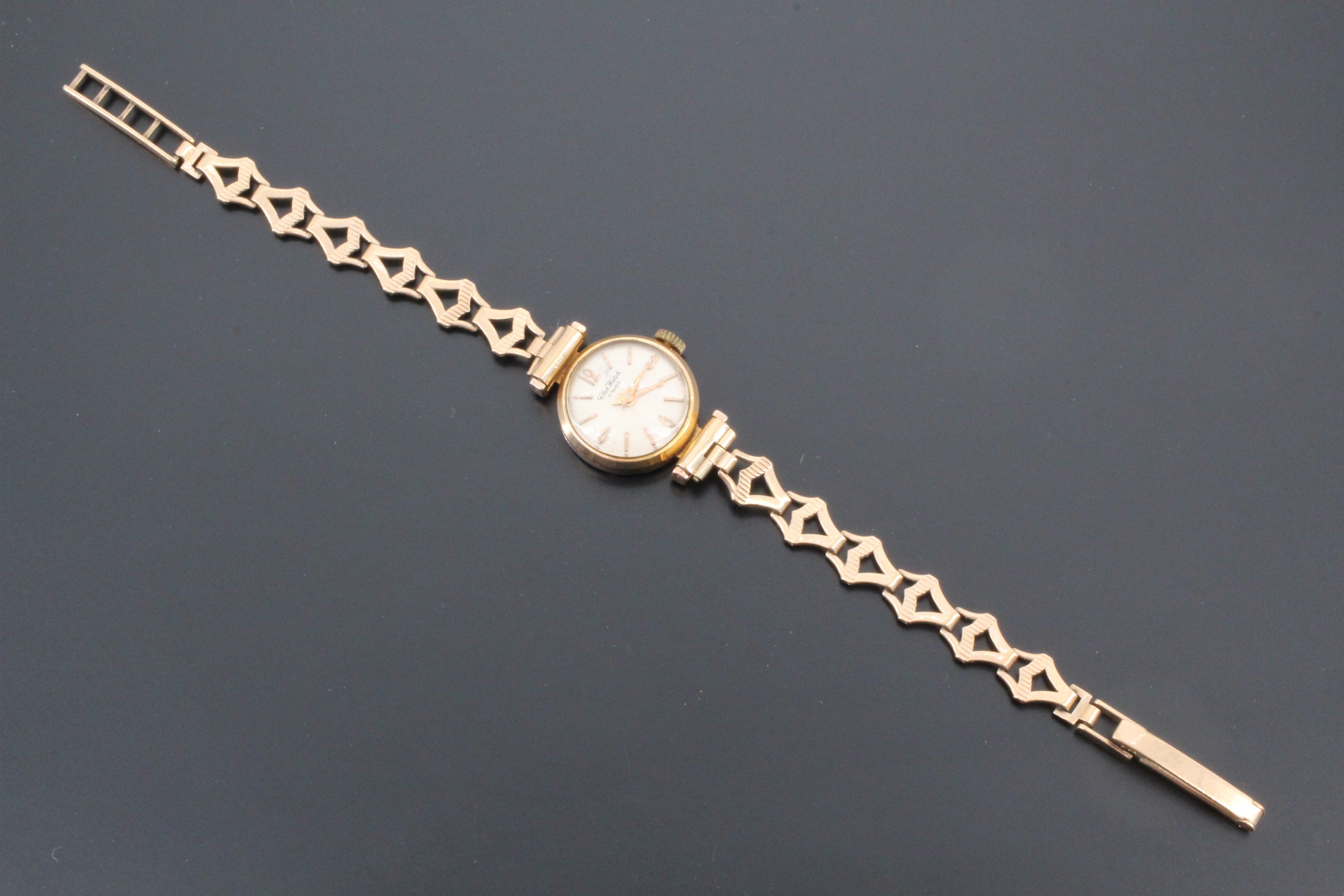 A late 1960s lady's Cler dress watch, having a gold plated case and 9 ct gold flexible bracelet