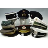 Eight European police hats, including French Gendarme's kepi, German police, Tenerife Military
