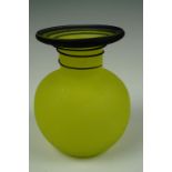 A late 19th / early 20th Century flecked yellow satin glass and blue trailed bottle vase of