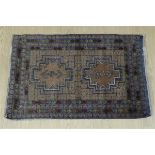A Persian wool pile rug, 136 x 90