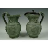 A pair of Victorian green ironstone relief-moulded bacchus-mask jugs (a/f), 22 cm