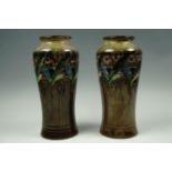 A pair of 1930s Royal Doulton stoneware vases of shouldered form decorated in a stylized floral