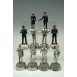 10 cast pewter figures of British Police officers, by Charles C. Stadden, four painted, C.11 cm