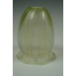 A early Twentieth Century vaseline glass lamp shade of organic form, 12 cm