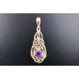 A contemporary amethyst and 9 ct gold Celtic interlaced pendant, 3 cm, 1.6 g