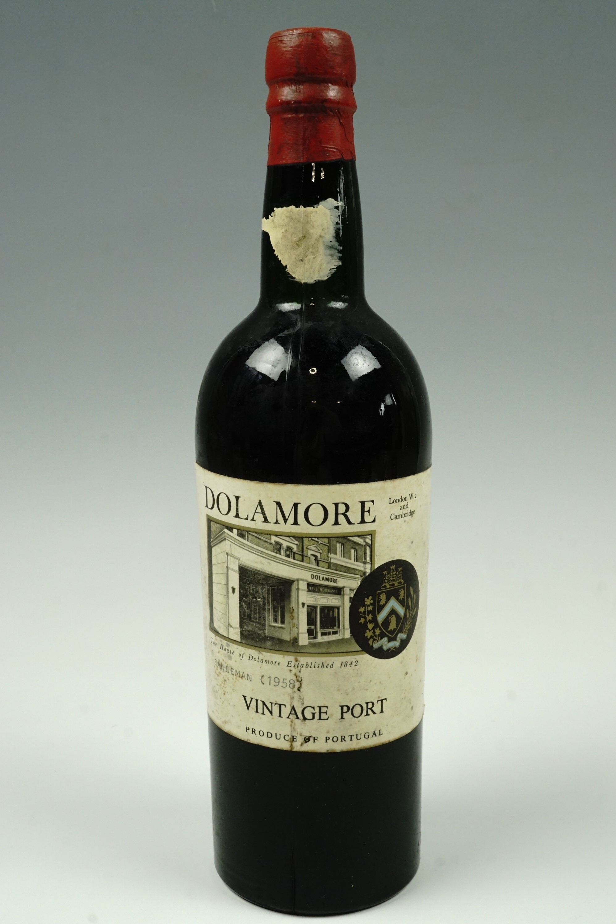 A bottle of Sandeman 1958 vintage port, bearing the label of the vintners Dolamore of London and