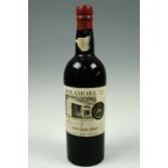 A bottle of Sandeman 1958 vintage port, bearing the label of the vintners Dolamore of London and
