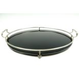 An Art Deco influenced black Vitrolite and electroplate drinks tray, second quarter 20th Century, 37