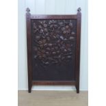 A carved wood fire screen, 89 x 55 cm