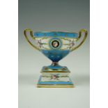An early Twentieth Century Minton loving cup with over glazed floral decoration, 11 cm