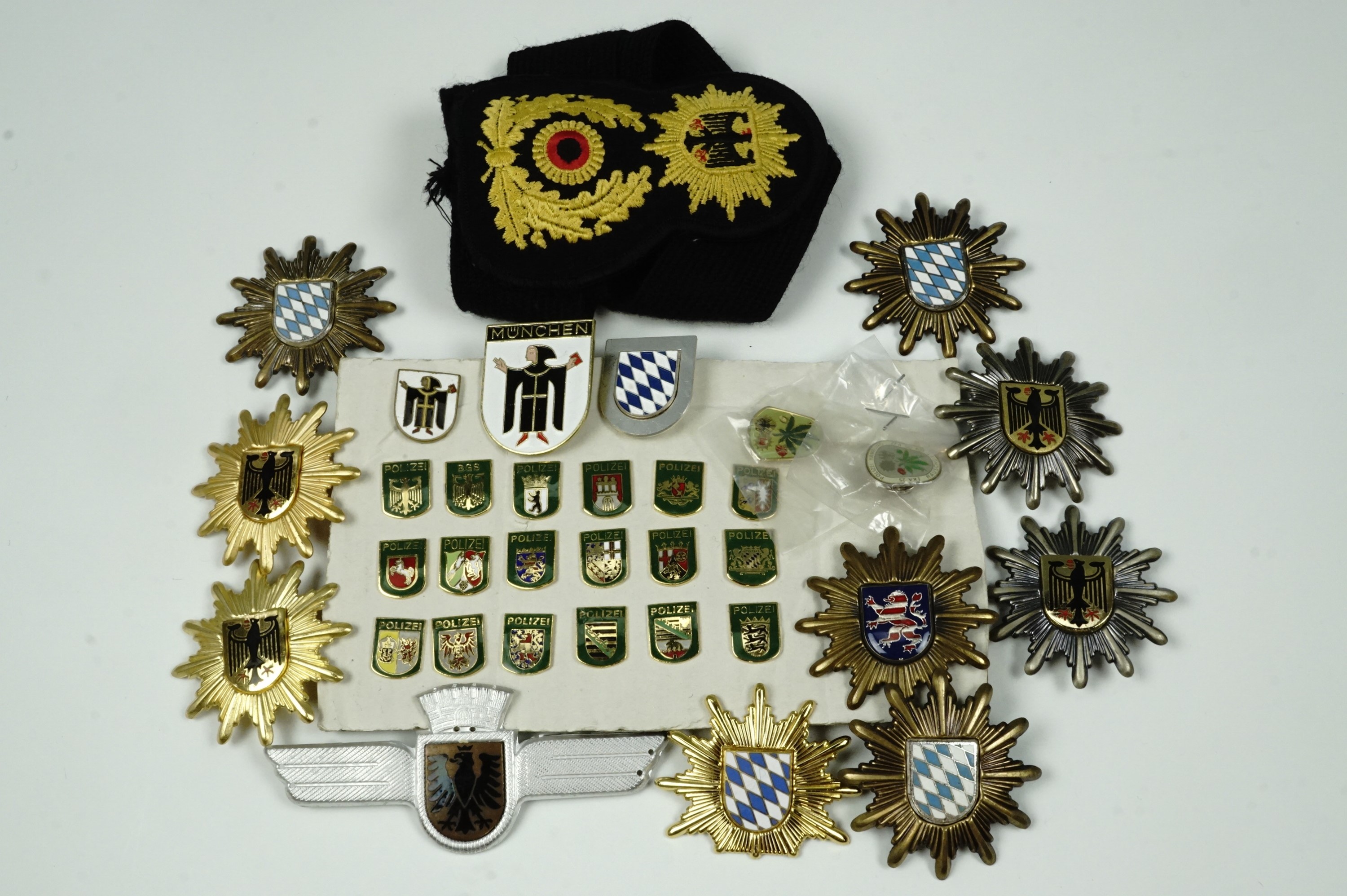 German police cap badges, arm band and enamel badges