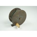A vintage brass Newcastle centre-pin fishing reel