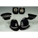 Six miniature police caps and helmets, comprising North Yorkshire Police, West Yorkshire Police