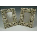 A pair of Baroque influenced frames, with a universal fold out stay, resin, 27 cm x 22. 5 cm