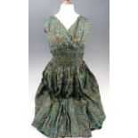 A vintage ladies silk dress together with a small quantity of silk scarfs including a Claire