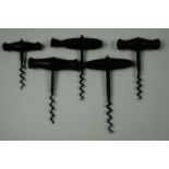 Two Mid 19th Century turned rosewood handled corkscrews and three further wooden handled examples