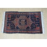 A Persian wool pile rug, 150 x 86 cm