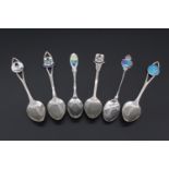 Six white metal souvenir spoons with enamel terminals relating to Bermuda, marked "sterling BMCo" 54