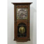 A late 19th / early 20th Century Jugendstil influenced oak cased wall clock, 70 x 28 x 14 cm