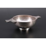 An Art Deco influenced silver porringer shaped bowl with lug handles, engraved on one side J.A.C.