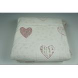 A Durham quilt with heart shaped stitched fabric patterns, 258 x 170 cm