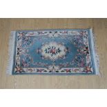 A Chinese blue ground rug, 157 x 92 cm