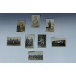 A small group of Great War Border Regiment photographic postcards including a portrait of Lieutenant