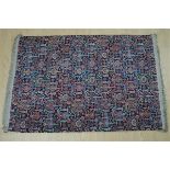 A large wool rug, 190 x 135 cm