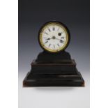 A 19th Century ebonised drum head clock, 21 cm