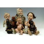 Early-to-mid 20th Century composition, fabric and moulded rubber dolls