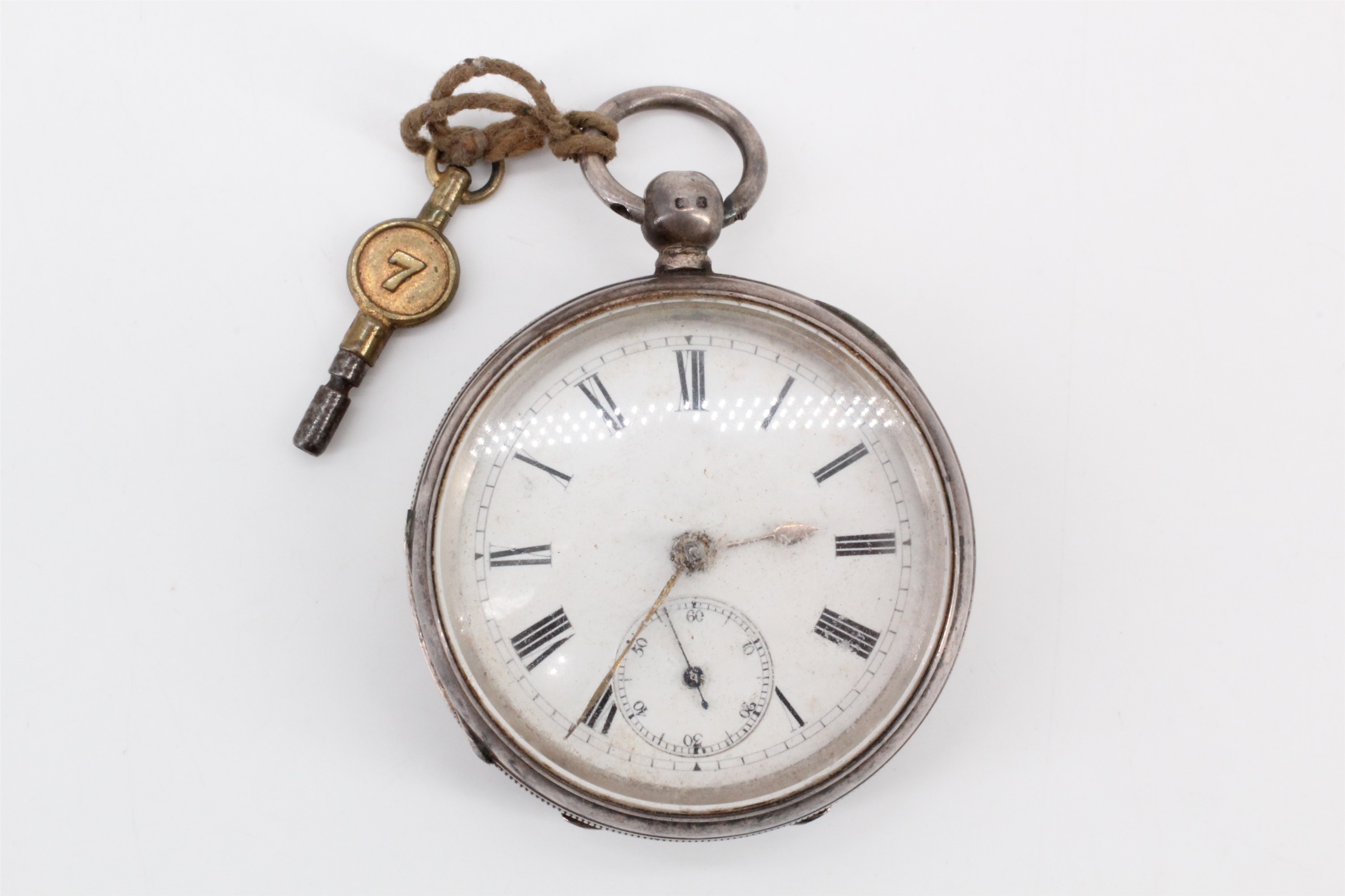 A Victorian silver cased pocket watch, having a white face with Roman numerals and subsidiary