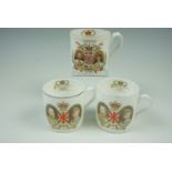 Two Shelley mugs commemorating the 1935 silver jubilee and another Shelley royal commemorative mug