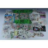 A quantity of franked and un-franked GB stamps together with world stamps etc
