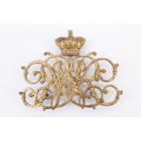 A Victorian officer's pouch badge, being gilt metal adorsed royal ciphers surmounted by an