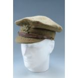 A Great War British army trench cap, bearing a 1st Monmouthshire Regiment badge