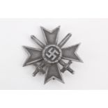 A German Third Reich War Merit Cross, first class, with swords, the pin stamped L/16