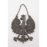 An electroplate pendant Polish eagle badge, bearing engraved initials verso and date 24.12.1942,