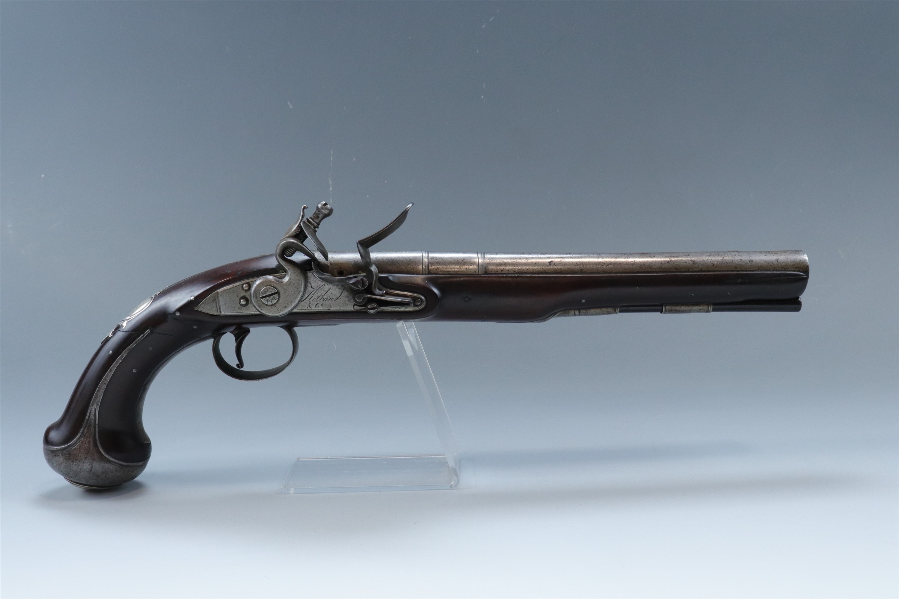 A George III white metal and iron mounted flintlock holster pistol by Ketland, having a 9 3/4 inch