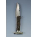 A Victorian folding lock knife, having a 5 1/2 inch Bowie shaped blade, its ricassos stamped TMW