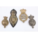Four Victorian and later army saddlery martingale / breastplate and similar badges