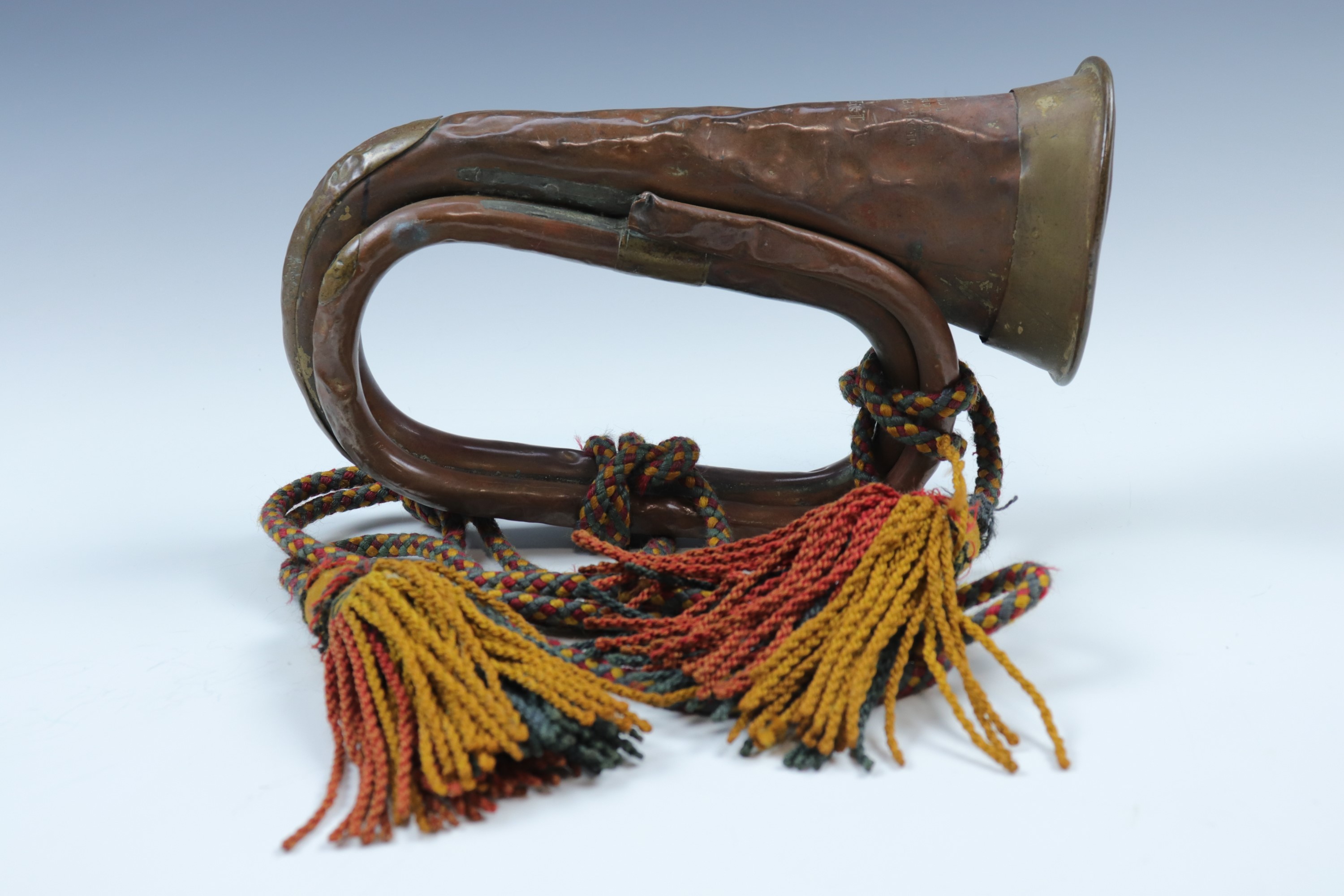 A Victorian British army bugle, dated 1890 and bearing 1st Battalion Scots Guards marks
