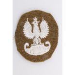 A Free Polish army machine embroidered cap badge, 42 mm