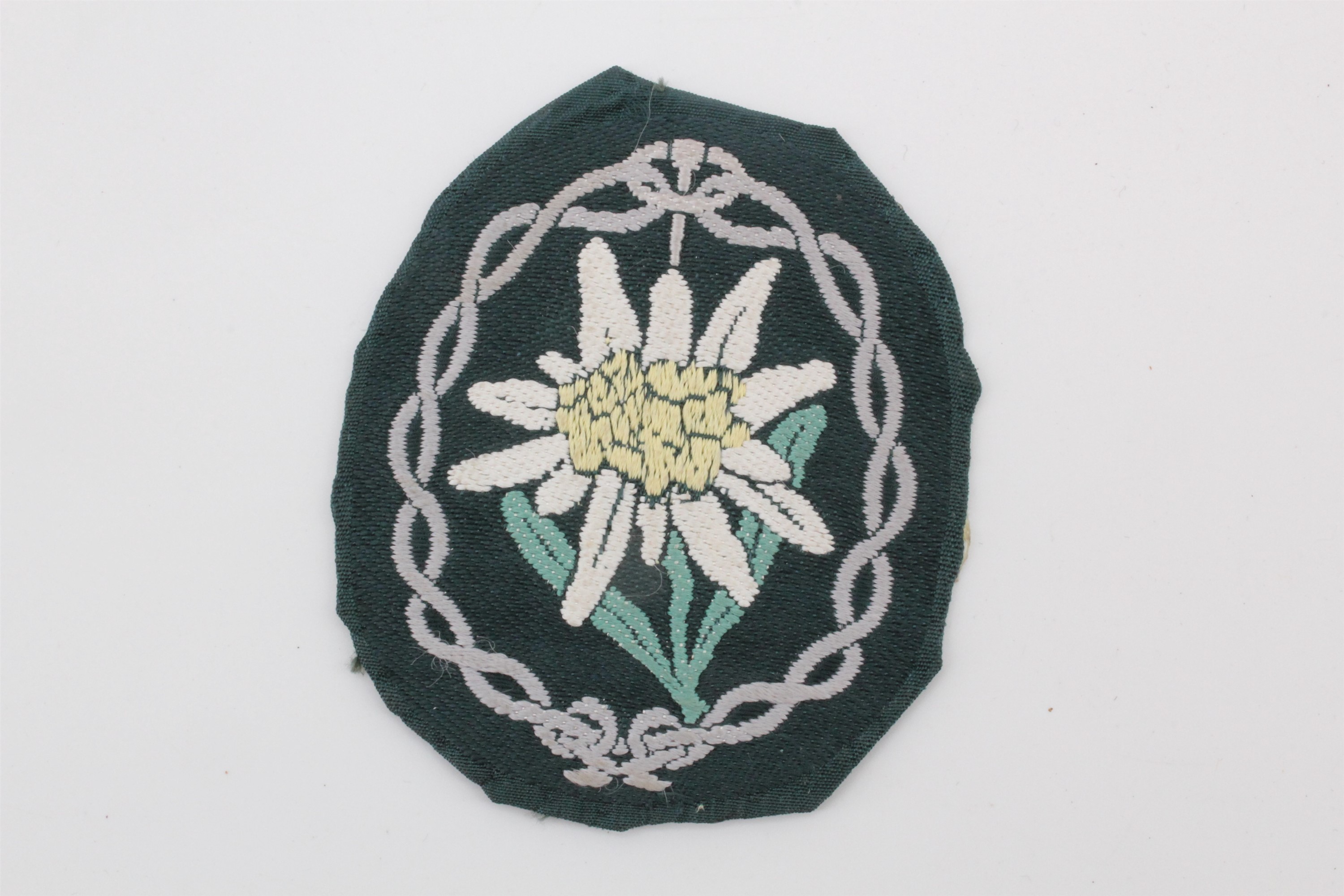 A German Third Reich mountain troops / gebirgsjager machine woven edelweiss arm badge
