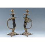 A pair of candlesticks fabricated from Imperial German army OD 1889 infantry officers' sword
