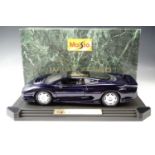 A boxed Maisto 1:12 scale die-cast model Jaguar XJ220 1992