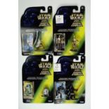 Four boxed Star Wars die-cast figurines of Luke Skywalker, Darth Vader, C-3PO and R2-D2
